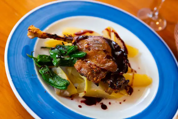 Photo of Duck confit in port with pear chutney