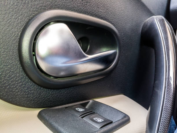 istock Modern luxury car door lock buttons and door open handle 1210500355