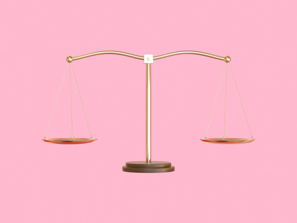 istock gold balance scale pink scene 3d rendering 1210501611