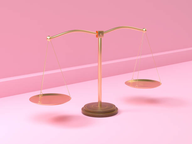 istock gold balance scale pink scene 3d rendering 1210501711