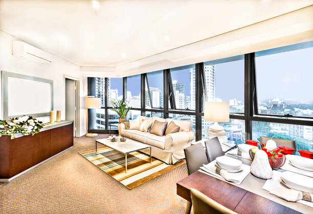 istock Modern living room interior with sofa set near city. 1210502864