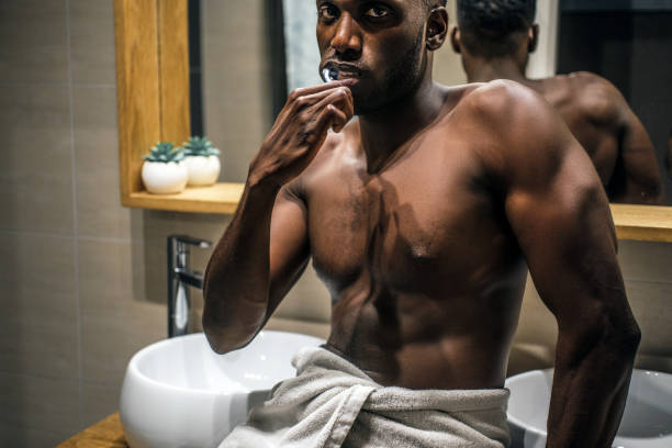 istock Concept of mourning routine - man is brushing his teeth 1210503210