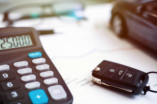 istock car sales chart concept visual. car keys, graphics and calculator 1210504303