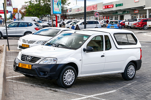 Berlin, Germany - 24th August, 2023: White electric delivery van BYD ETP3 parked on a street. The ETP3 is a small delivery van from BYD - one of the largest global automotive company.