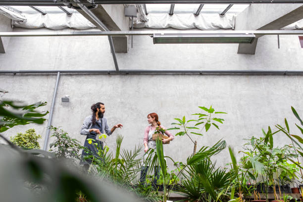 istock Two People working at the botanical garden 1210509658