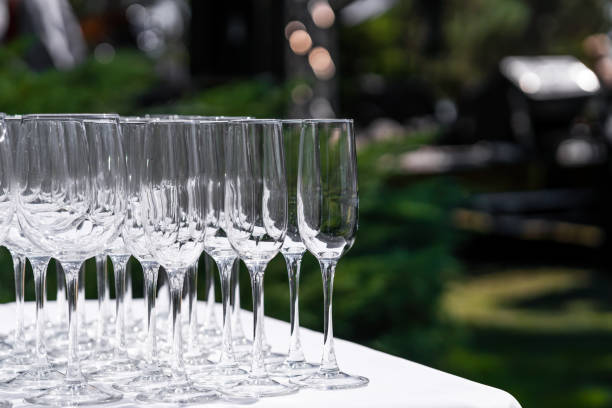 istock Set of blank empty wine glasses displayed in rows. Preparation for the holiday. 1210510825