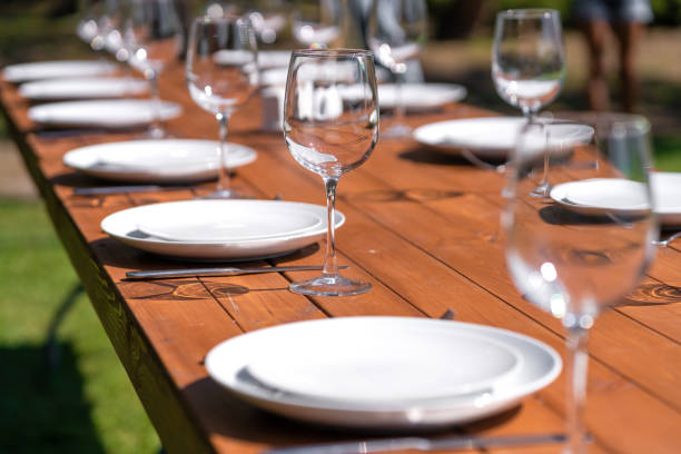 istock Served wooden table without a tablecloth. Cafe in the open air park 1210511069