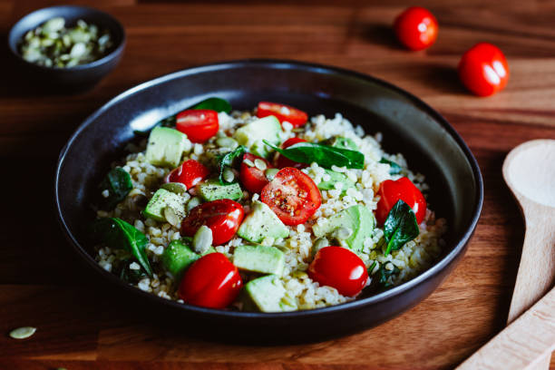 istock Healthy salad with bulgur, avocado, spinach and cherry tomatoes. 1210513757
