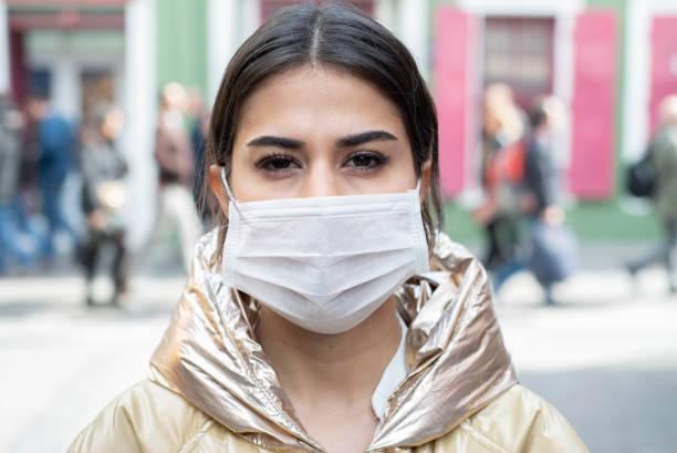 istock Young woman wearing a mask 1210513832