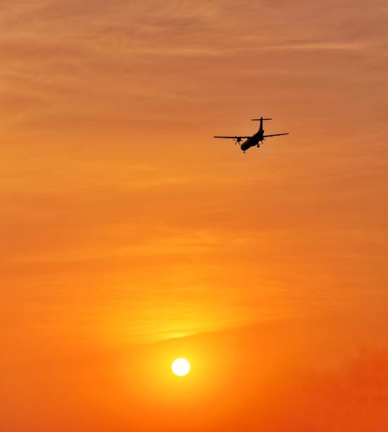 istock Airplane Against The Sun 1210513919