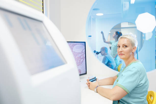 istock Medical research at the lab. Scientist in laboratory working with medical samples  using modern equipment. Laboratory Medical Equipment Medical devices for analyzes. Blood tested for Coronavirus (COVID-19),  Cancer. definition of DNA, virus, 1210514178