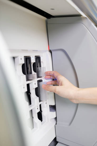 istock Medical research at the lab. Scientist in laboratory working with medical samples  using modern equipment. Laboratory Medical Equipment Medical devices for analyzes. Blood tested for Coronavirus (COVID-19),  Cancer. definition of DNA, virus, 1210514482