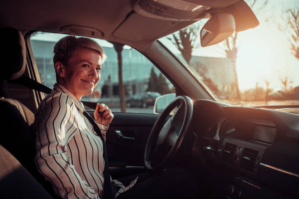 istock Smiling woman in a car 1210515531