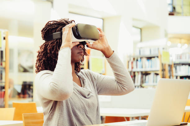 African American female student adjusting VR headset
