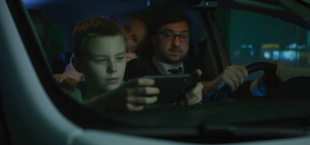 istock Man driving unsafely with children 1210515897