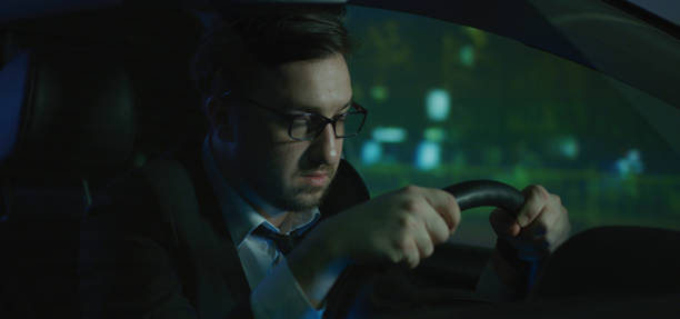 istock Sleepy man driving at night 1210515898