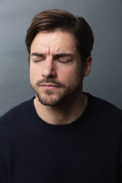 istock portrait of handsome  man with eyes closed 1210516103