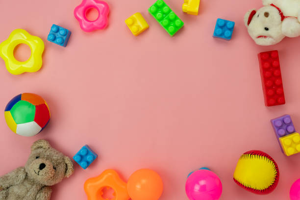 istock Table top view decoration kid toys for develop background concept.Flat lay accessories baby to play with items child on modern pink paper at office desk.Copy space for add text.pastel tone wallpaper. 1210518648