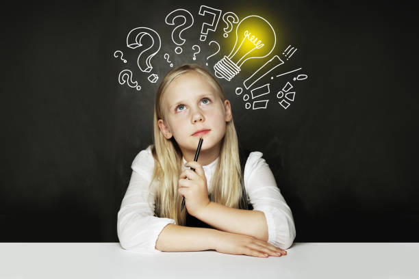 istock Child girl with lightbulb. Concept Ideas and projects 1210518744