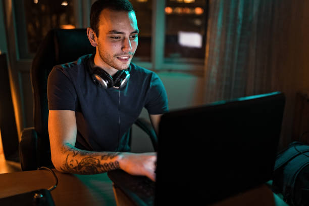istock Young man with laptop at home 1210520085