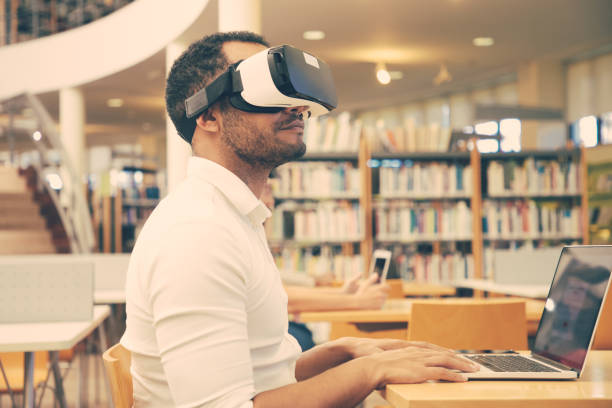 istock Adult male student training with VR headset 1210520461