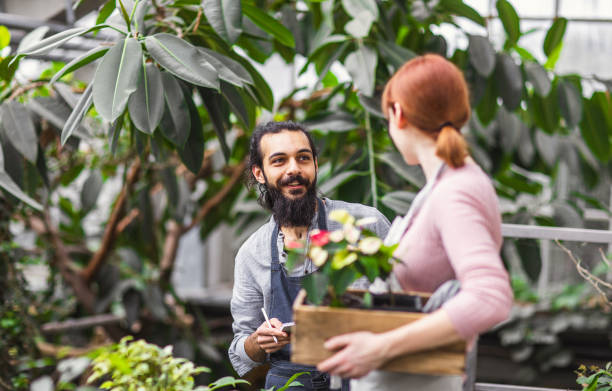 istock Two People working at the botanical garden 1210520891