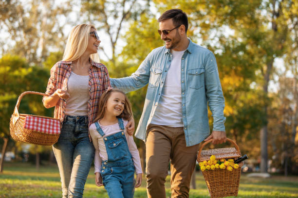 istock Happy family having picnic in nature 1210521737