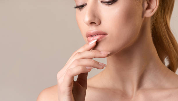 istock Sensual Girl Touching Lips Posing Over Beige Studio Background, Cropped 1210521919