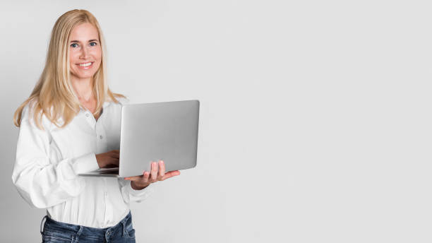 istock Confident Mature Woman Smiling At Camera At Studio 1210522196