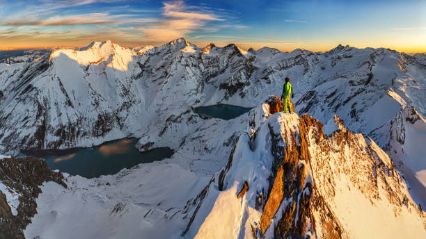 istock Climbers enjoy the view from the summit in the sunset 1210522344
