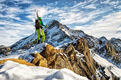 Ski climber with a view of the summit