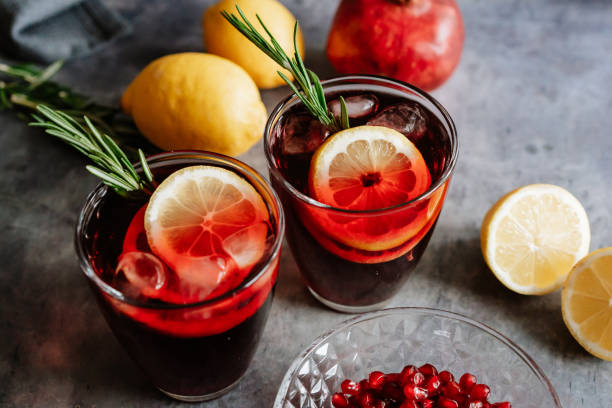 istock Pomegranate drink in a glass with lemon and rosemary 1210522983