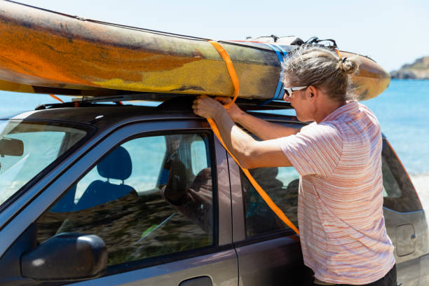 istock Attaching a Kayak to a Car 1210524108