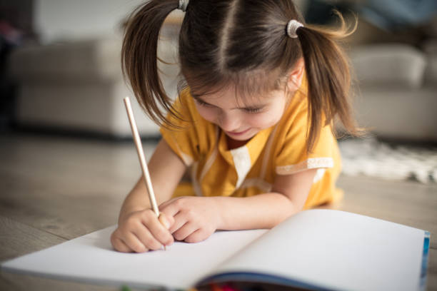 istock She's all about finishing her homework. 1210528514