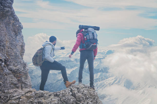 istock Trekkers on top of mountain peak. 1210530293