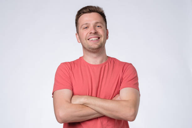 istock Young caucasian self confident man standing with his arm crossed over white background 1210530578