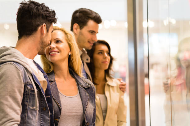 istock Couple having a moment of affection while window shopping 1210531776