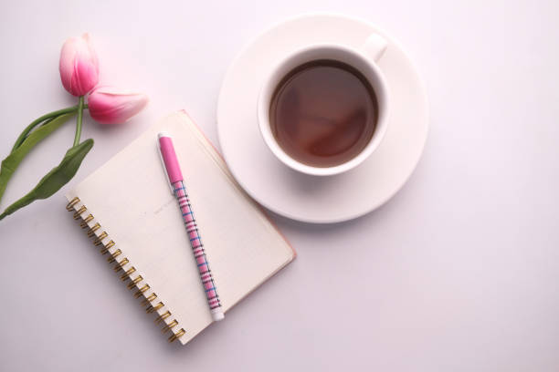 istock top view of tea, notepad, flower for morning breakfast 1210531899