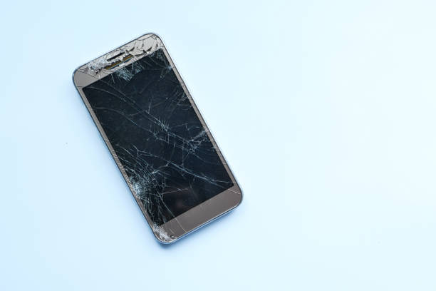 istock top view of broken smart phone on white background 1210531963