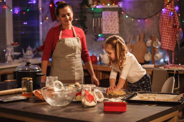 istock Mother and little daughter cooking together 1210535334