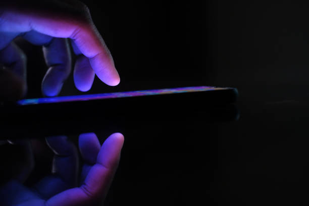 istock Close up of man hand use smart phone at night 1210535409