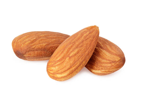 istock almond isolated on white background. Nuts on white background. 1210537060