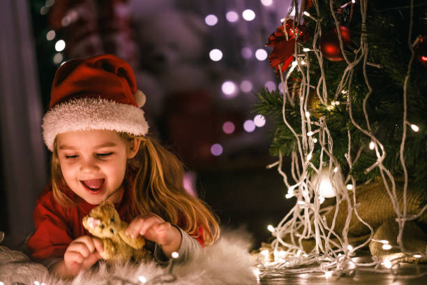 istock New Year's celebration by the Christmas tree 1210537740
