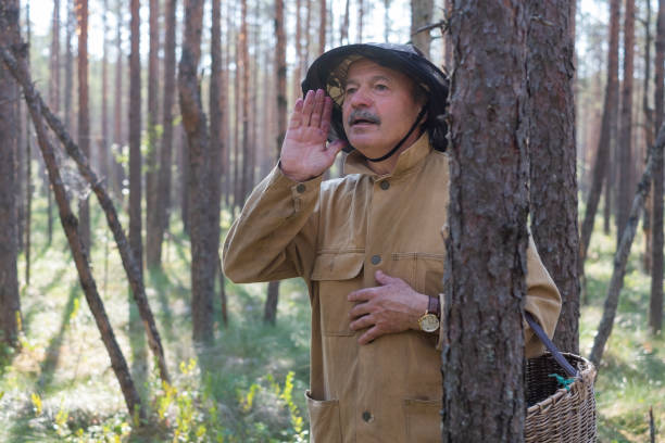 istock lost mature man in forestshouting trying to find way. 1210542149
