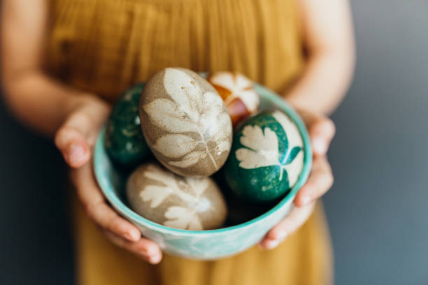 istock Young girl holds naturally dyed easter eggs 1210543091