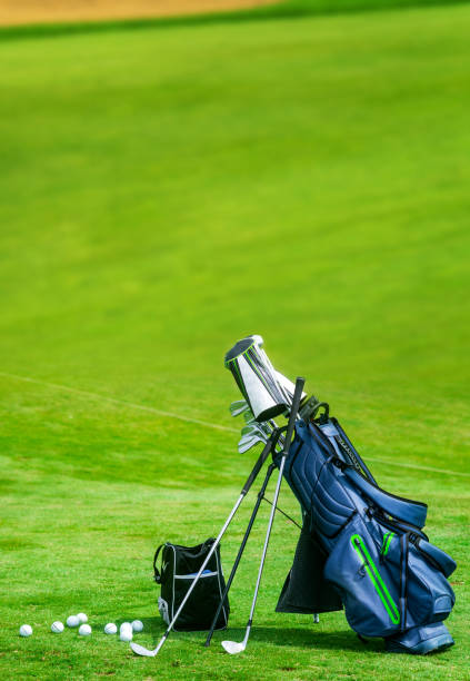 istock Bag of golf clubs on the golf course vertical copy space 1210543097