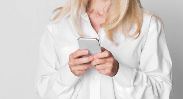istock Mature Businesswoman Texting On Cellphone At Studio 1210544051