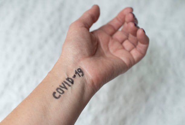 istock Coronavirus. Text Covid-19 written on hand. Welcome to club. 1210545006