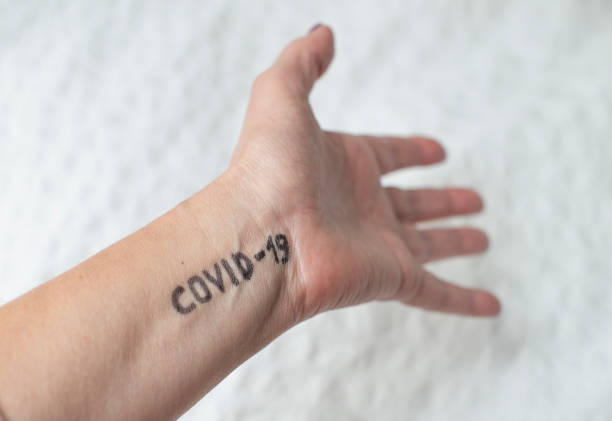 istock Coronavirus. Text Covid-19 written on hand. Welcome to club. 1210545007
