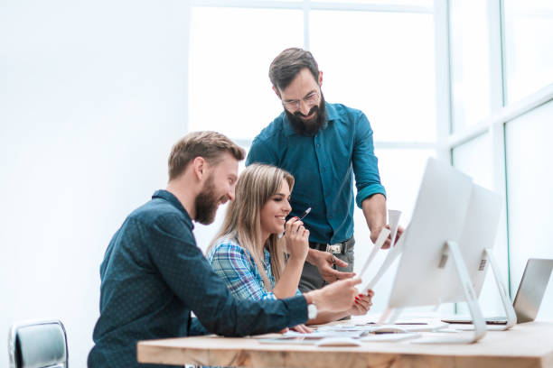 istock smiling employees checking financial statements . business concept 1210545182